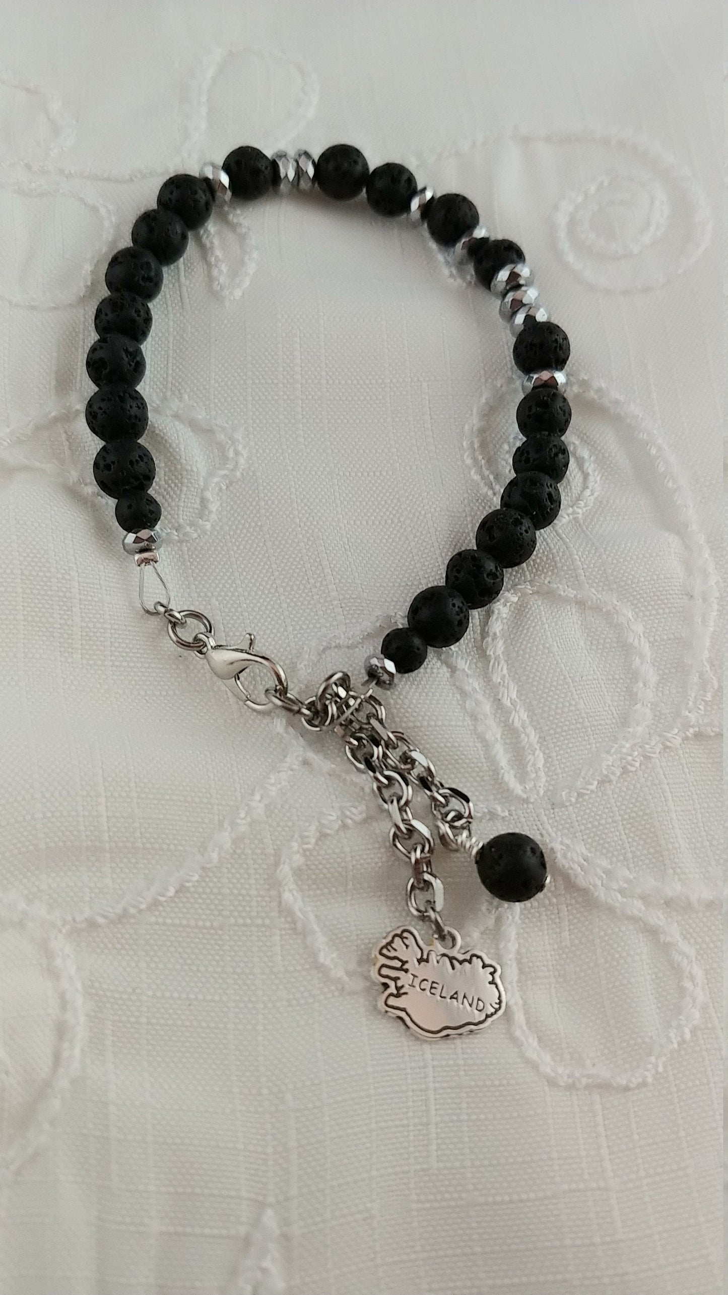 Beaded Hematite and Lava Bracelet with dangling Iceland and Lava Charm - Strung on Wire with Lobster Claw Clasp