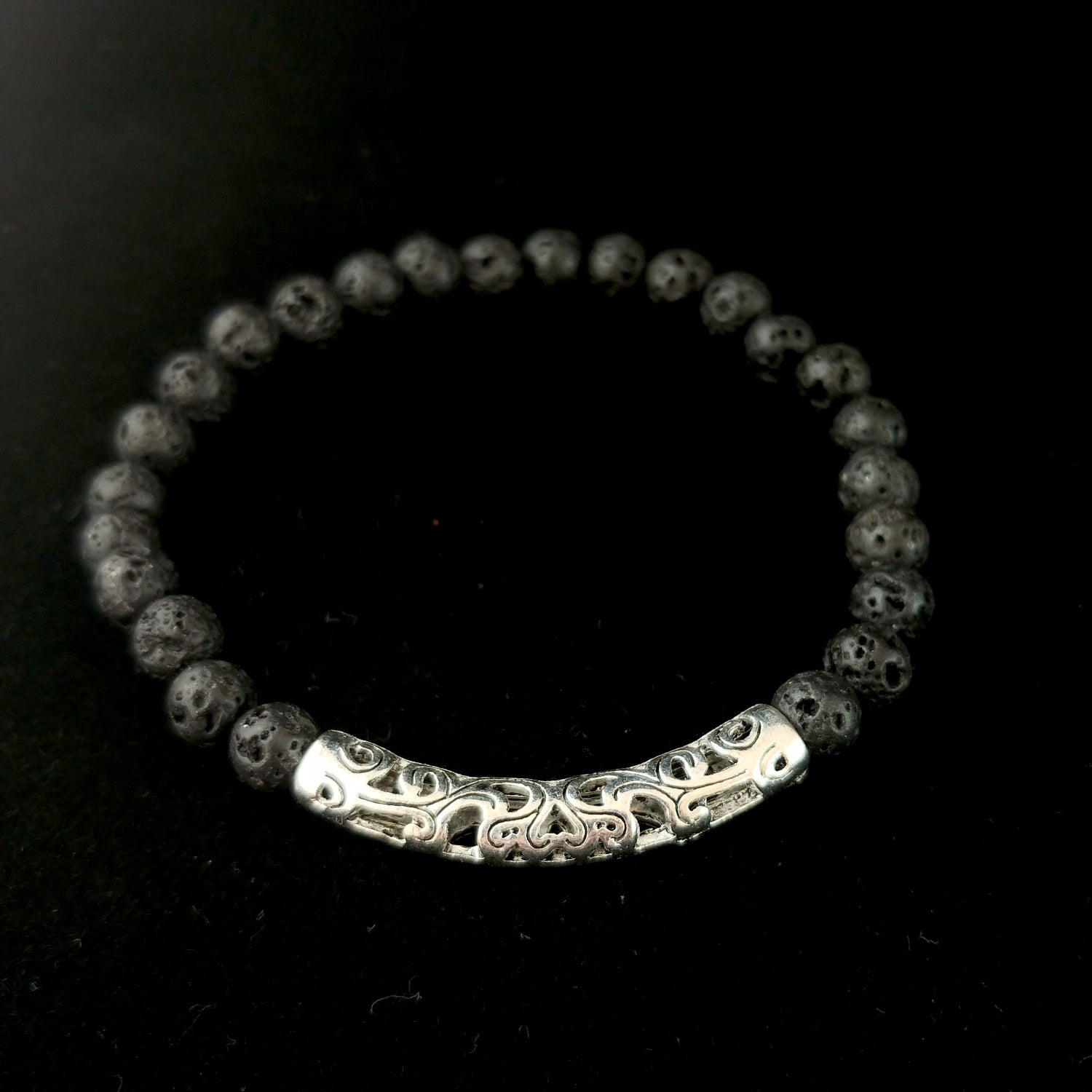 Frigg bracelet - with small lava beads and a long silver colored centerpiece with wave inlay.